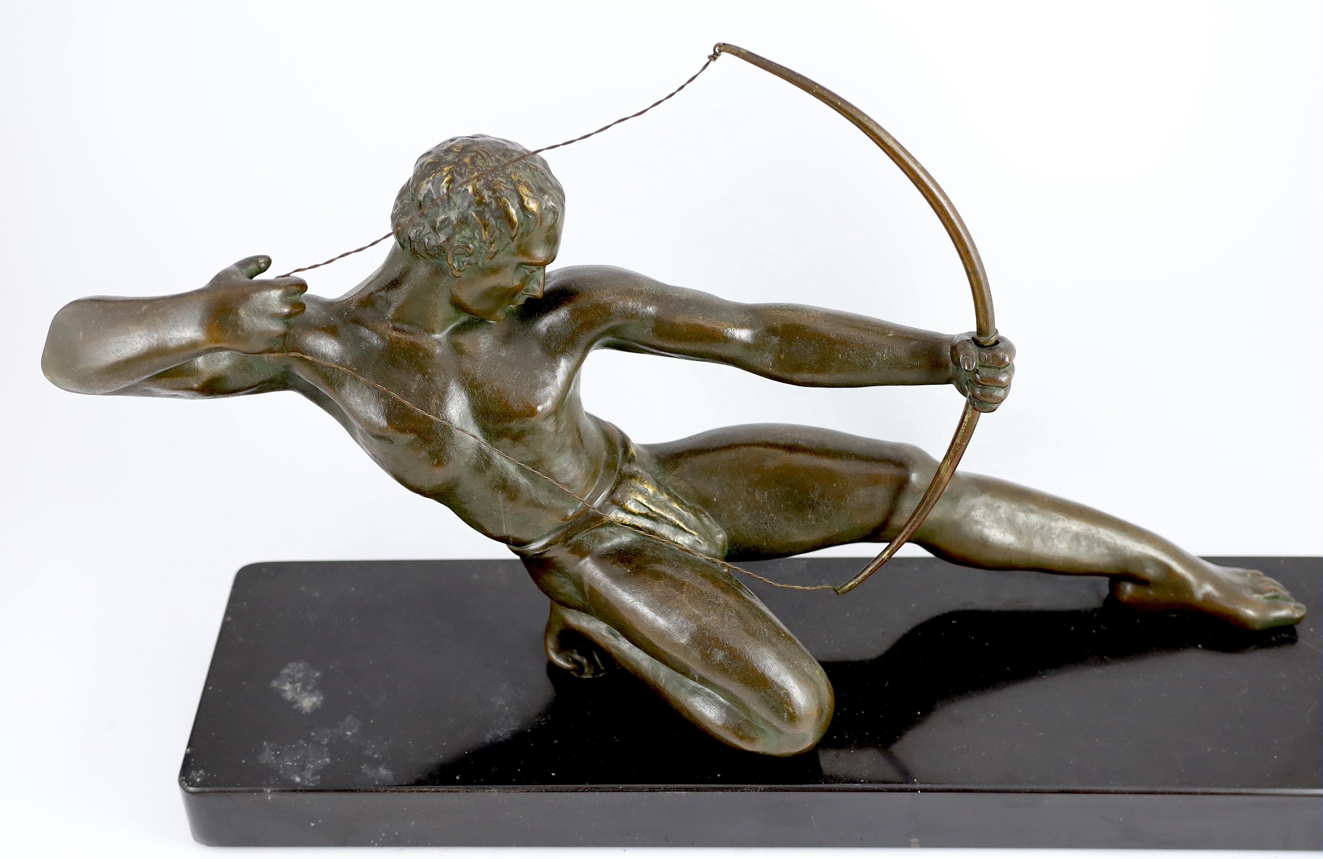 Salvator Riolo. NB. An Art Deco bronze figure of an archer, length 69cm depth 17cm height 39cm